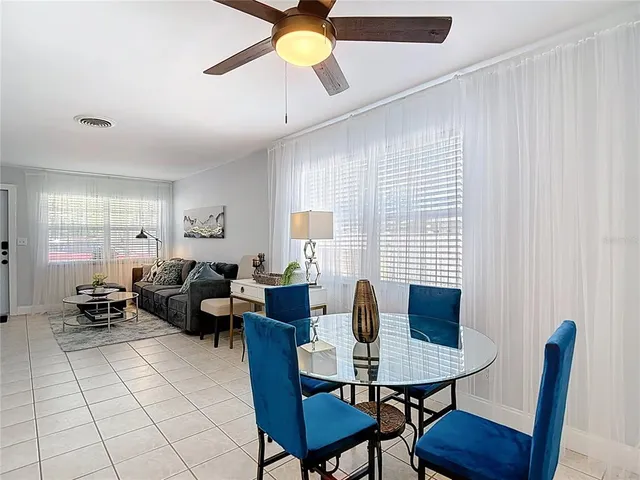 a kitchen with white cabinets sink and appliances