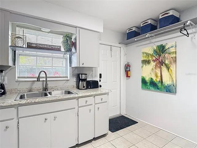 a view of a storage & utility room with a window