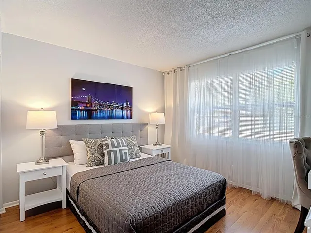 a bedroom with a bed and a couch