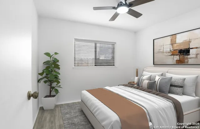 a bedroom with a bed and a window