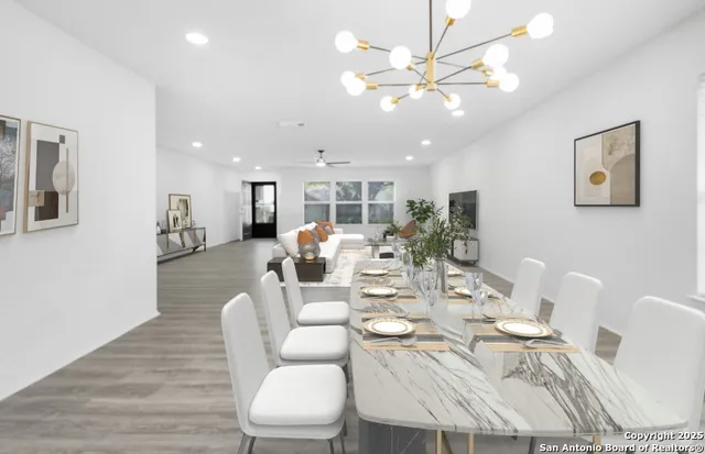 a view of a dining room with furniture and wooden floor