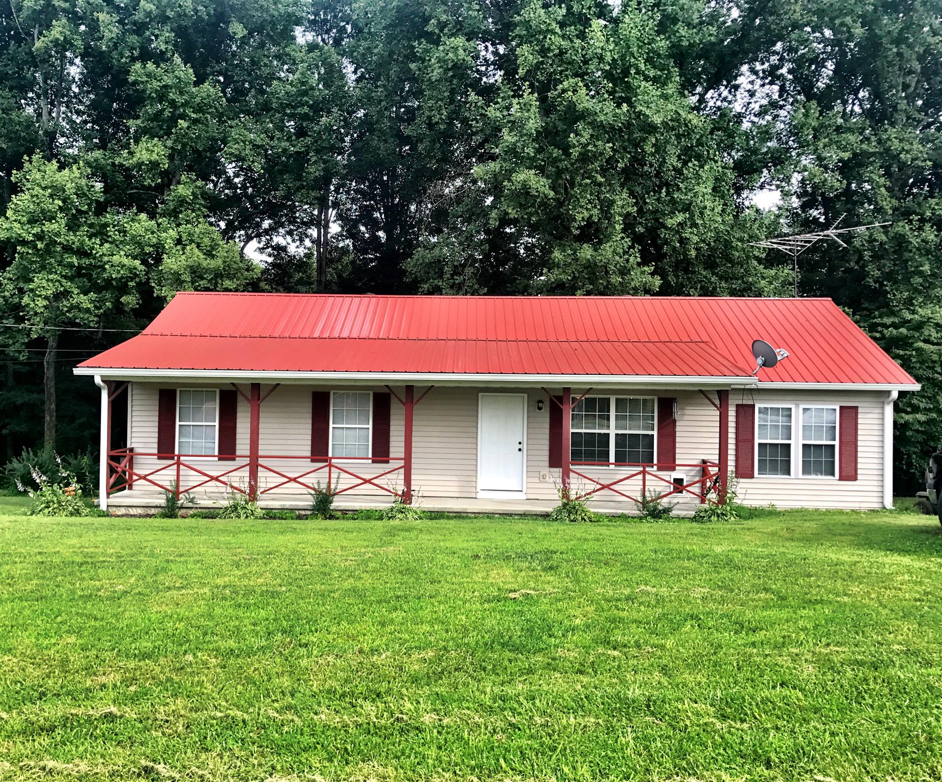 88 Redbud Road Red Boiling Springs, TN 37150 - Photo 1 of 19 a front view of house with yard and green space