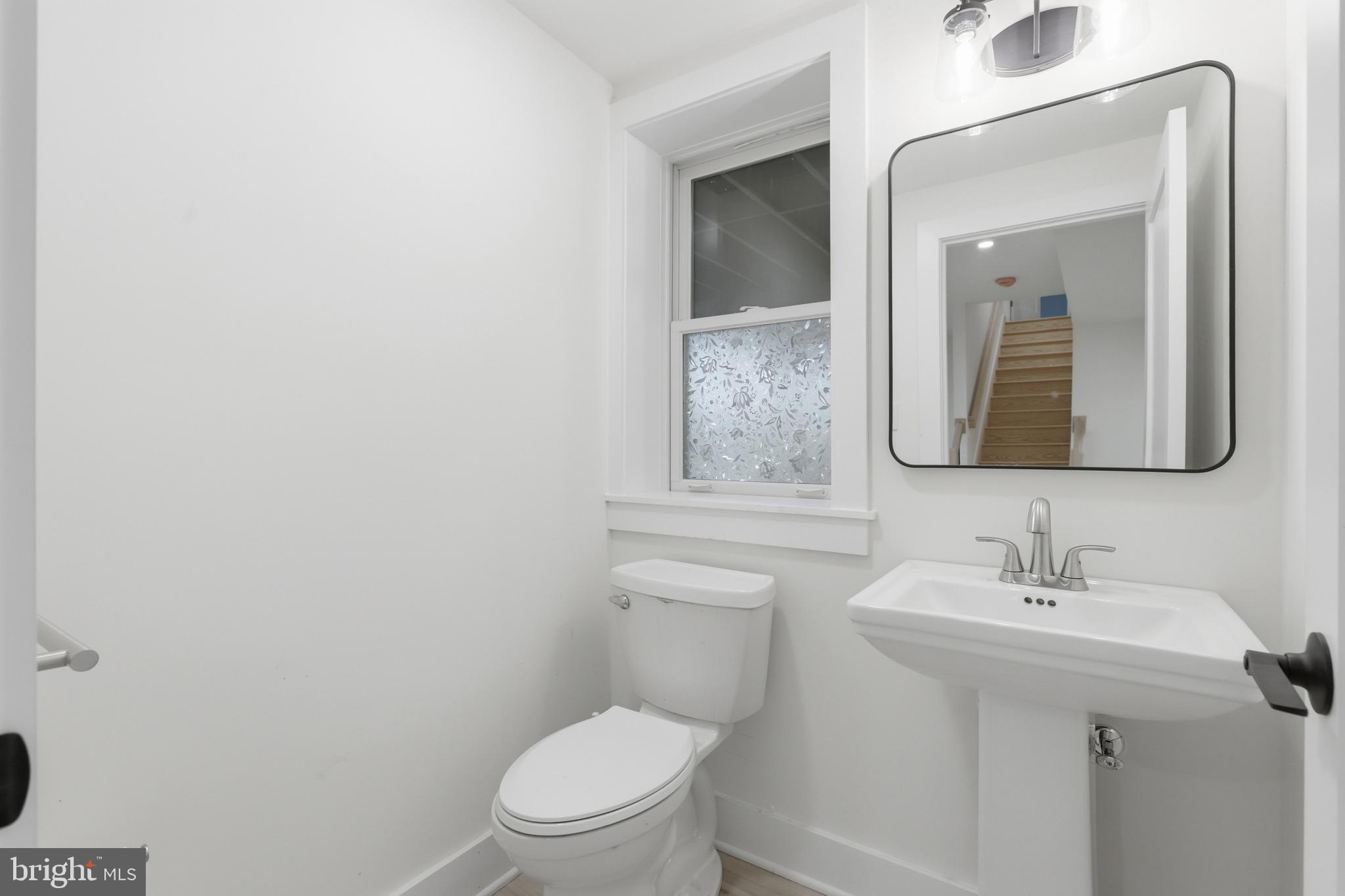 759 River Road Erwinna, PA 18920 - Photo 41 of 46 a bathroom with a toilet a sink and mirror