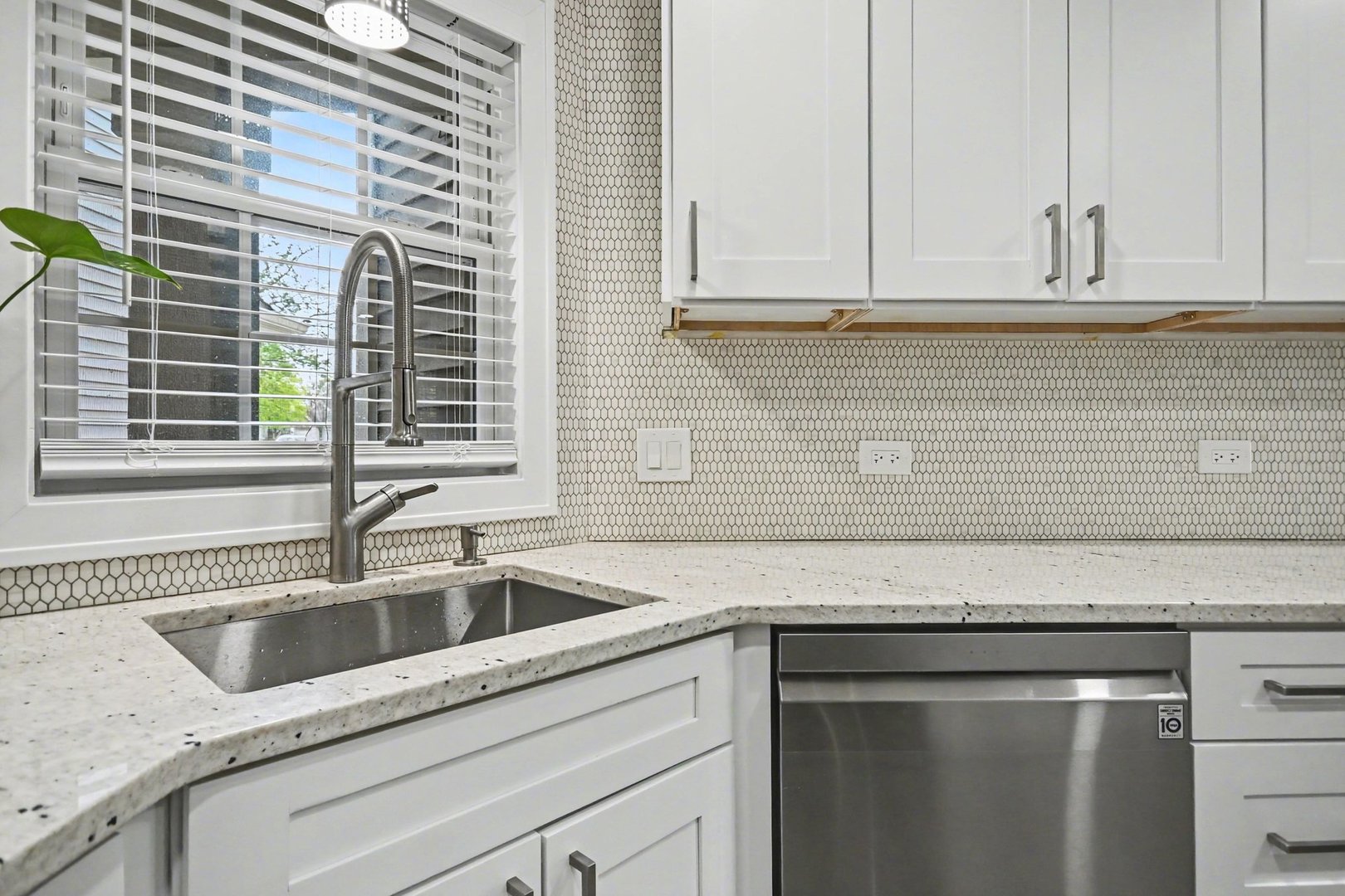 850 Spring Creek Court Elk Grove Village, IL 60007 - Photo 14 of 26 a kitchen with granite countertop white cabinets and a sink
