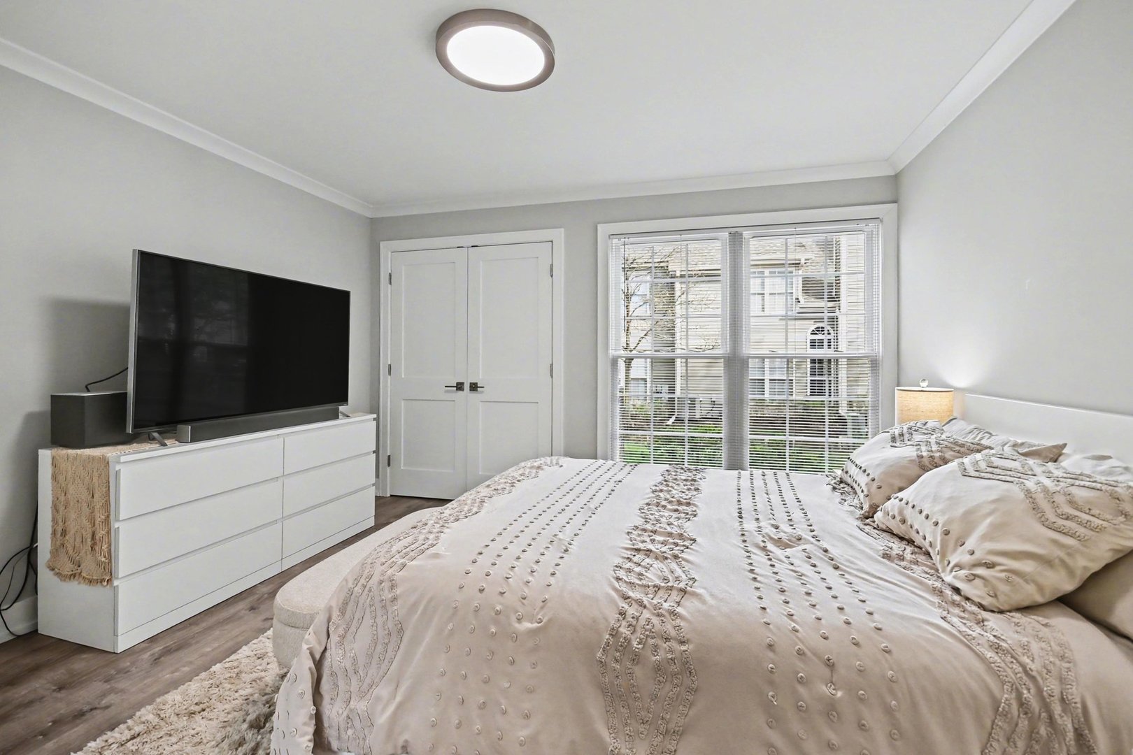 850 Spring Creek Court Elk Grove Village, IL 60007 - Photo 17 of 26 a bedroom with a bed and a flat screen tv