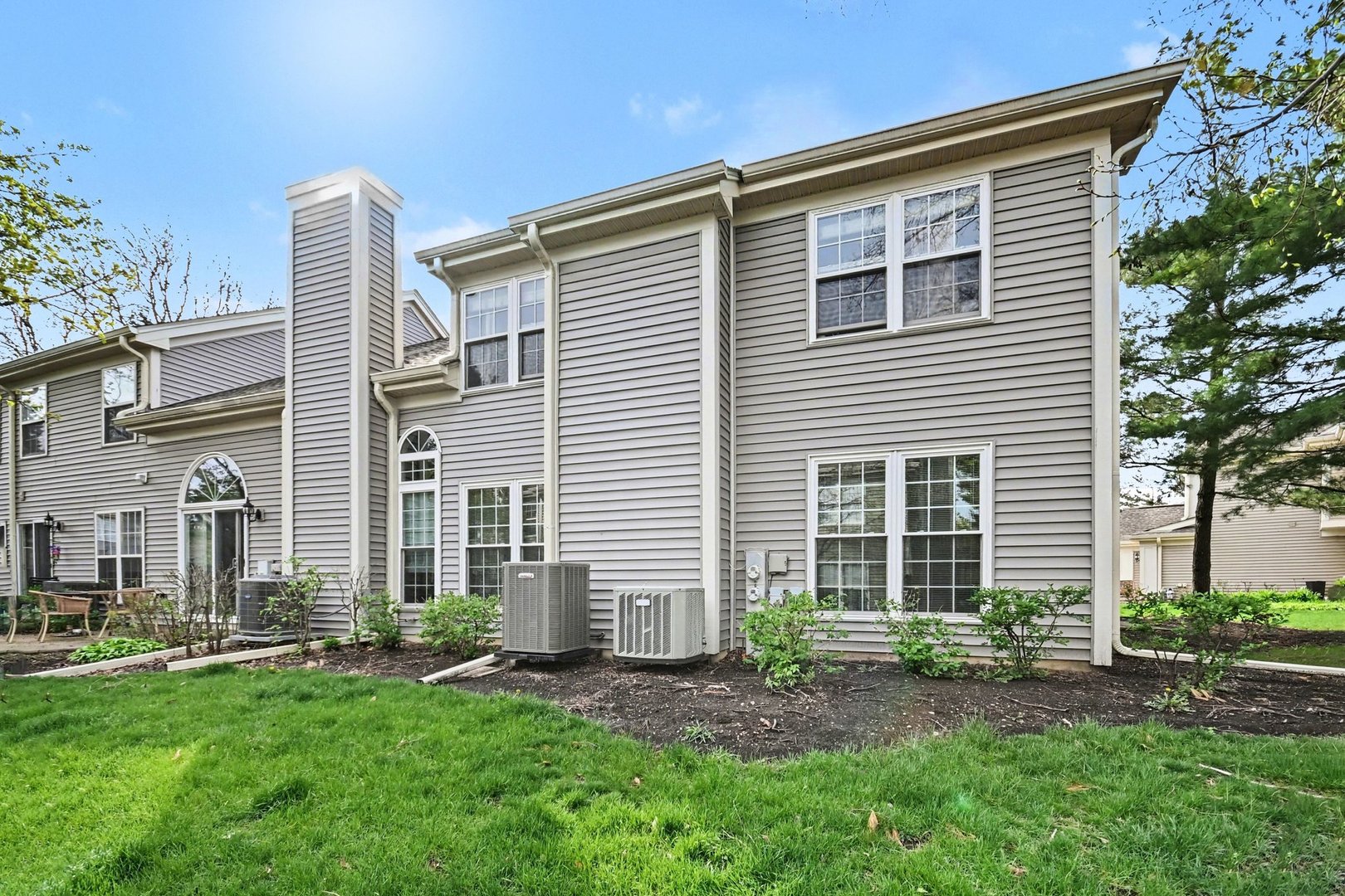 850 Spring Creek Court Elk Grove Village, IL 60007 - Photo 23 of 26 a front view of a house with a yard and porch
