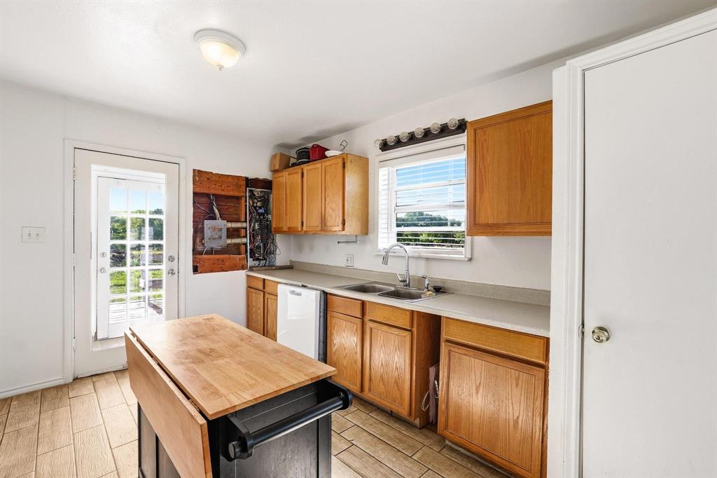 2092 County Road 5010 Blue Ridge, TX 75424 - Photo 14 of 28 a kitchen with stainless steel appliances granite countertop a sink stove and refrigerator