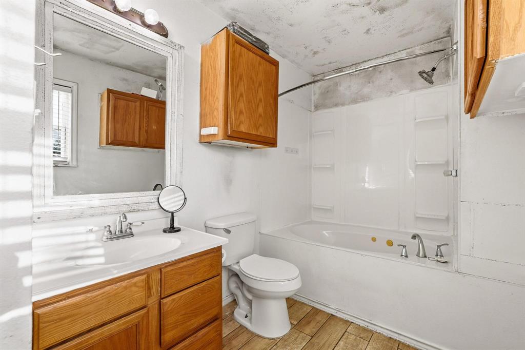 2092 County Road 5010 Blue Ridge, TX 75424 - Photo 20 of 28 a bathroom with a sink a toilet and shower