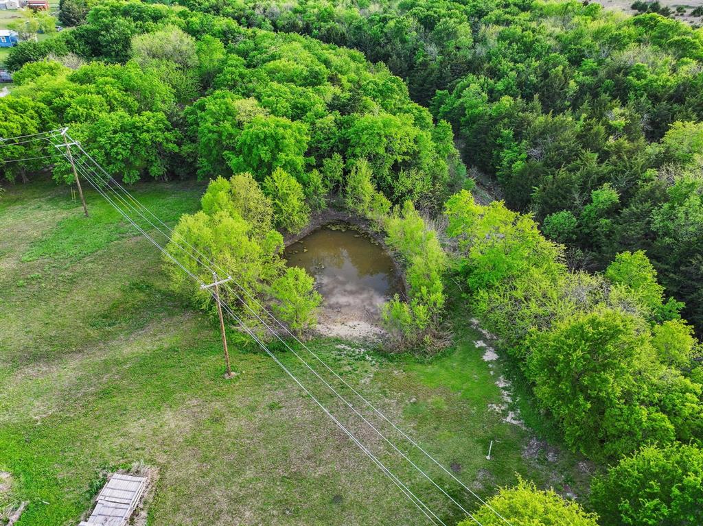 2092 County Road 5010 Blue Ridge, TX 75424 - Photo 27 of 28 a backyard of a house with lots of green space