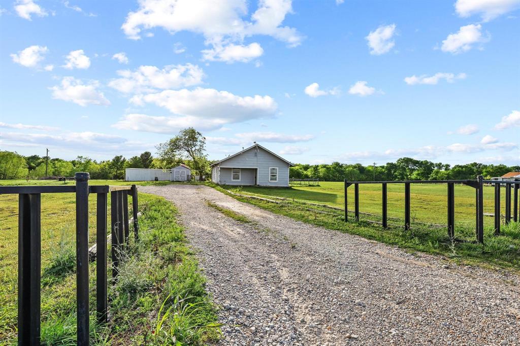 2092 County Road 5010 Blue Ridge, TX 75424 - Photo 6 of 28 a view of a house with a yard and fence