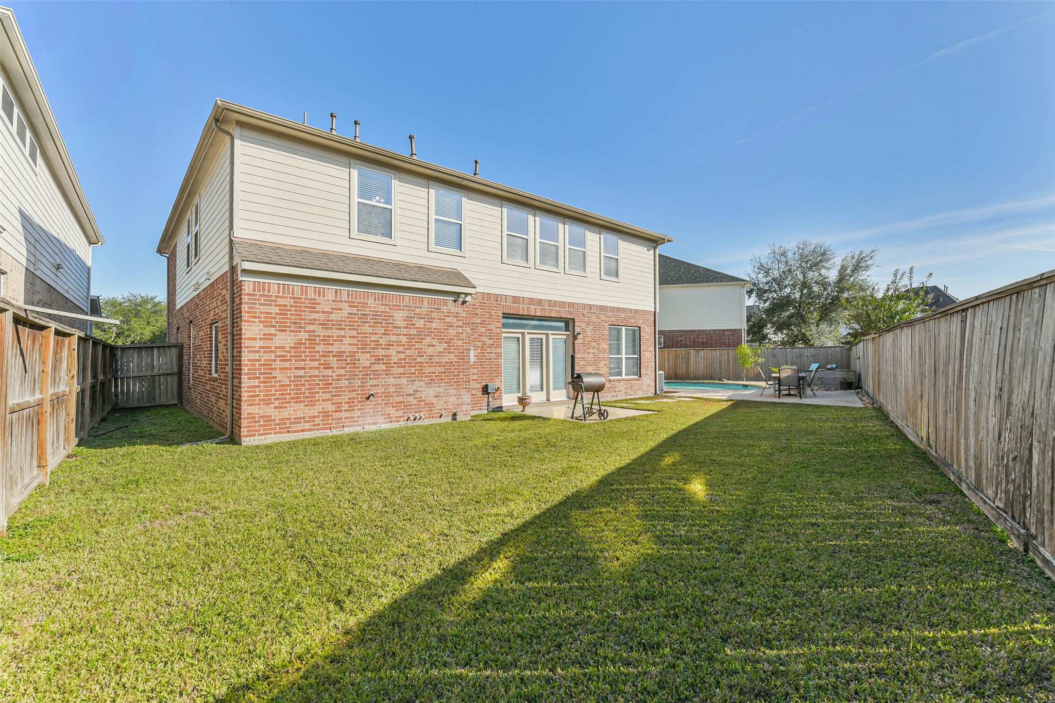 19022 Greenleaf Ridge Court Cypress, TX 77429 - Photo 44 of 47 a backyard of a house with lots of green space
