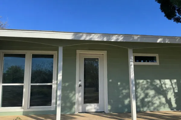 a front view of a house with a glass door