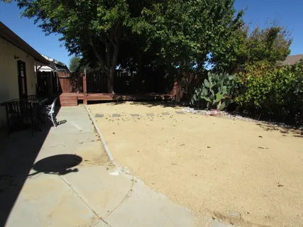a view of a backyard of the house