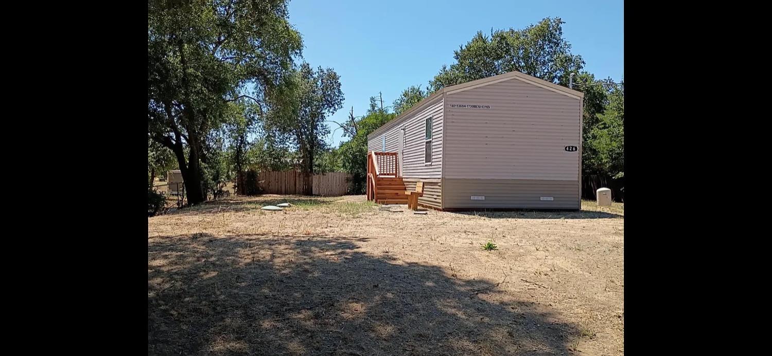 426 Stimpson Road Oroville, CA 95965 - Photo 4 of 16 a backyard of a house with large trees