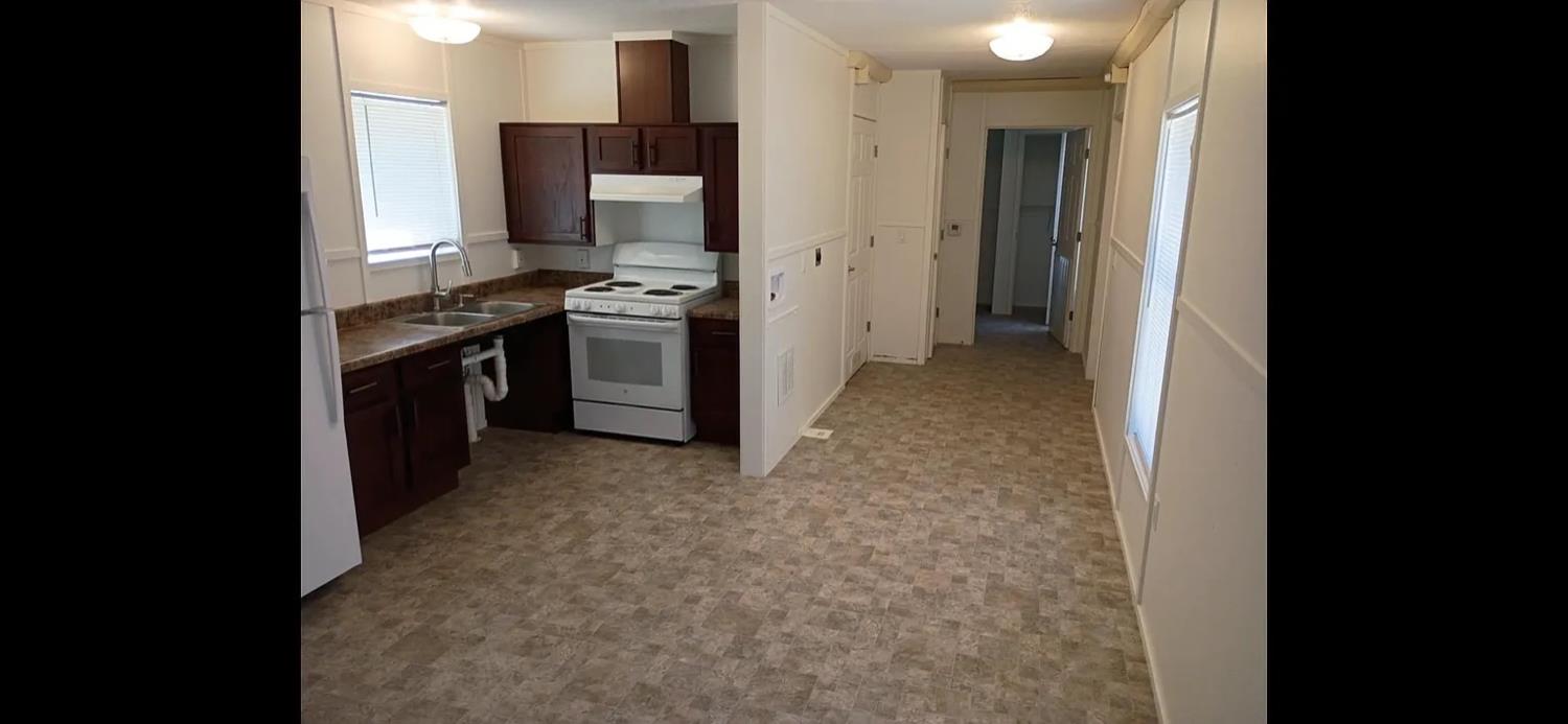 426 Stimpson Road Oroville, CA 95965 - Photo 6 of 16 a kitchen with stainless steel appliances granite countertop a refrigerator and a stove