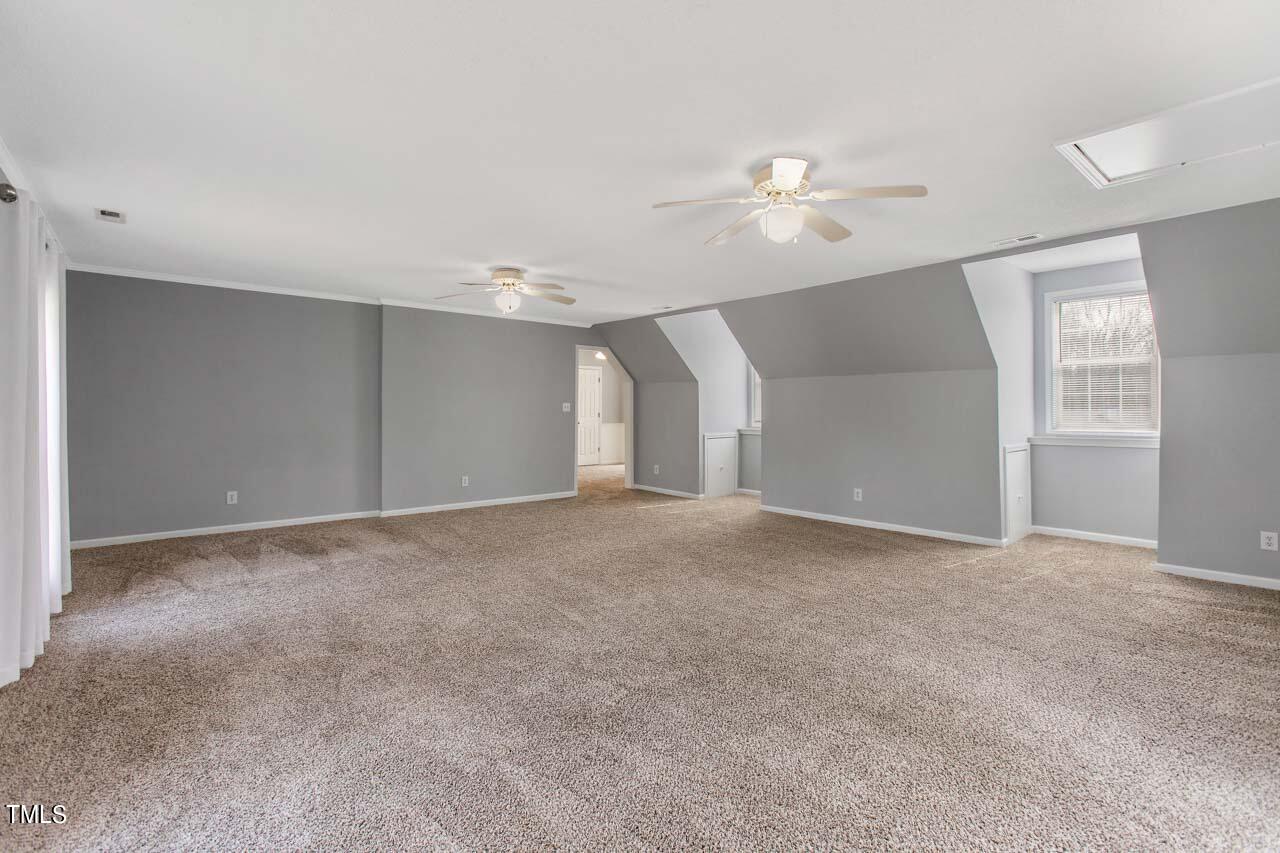 2000 Ruddy Road Raleigh, NC 27616 - Photo 11 of 20 a view of a big room with windows and ceiling fan