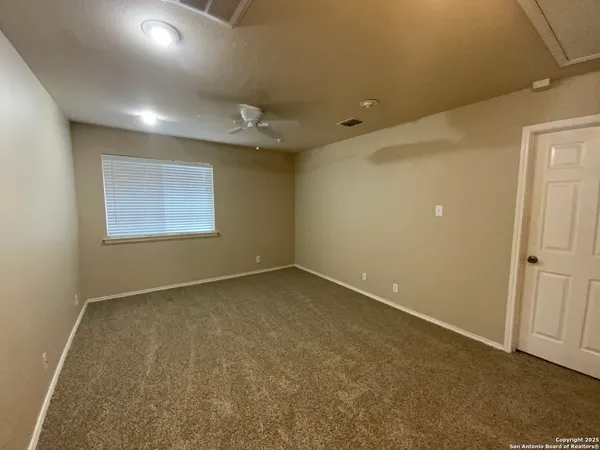 an empty room with a empty space and windows