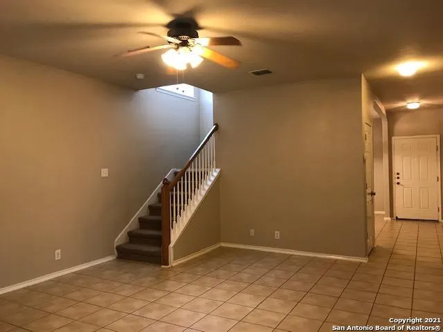 wooden floor in a hall with a window