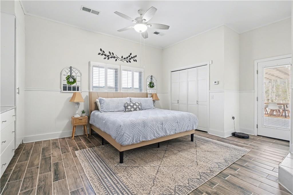 1833 Tom Odum Road Vidalia, GA 30474 - Photo 25 of 59 a spacious bedroom with a bed and a window