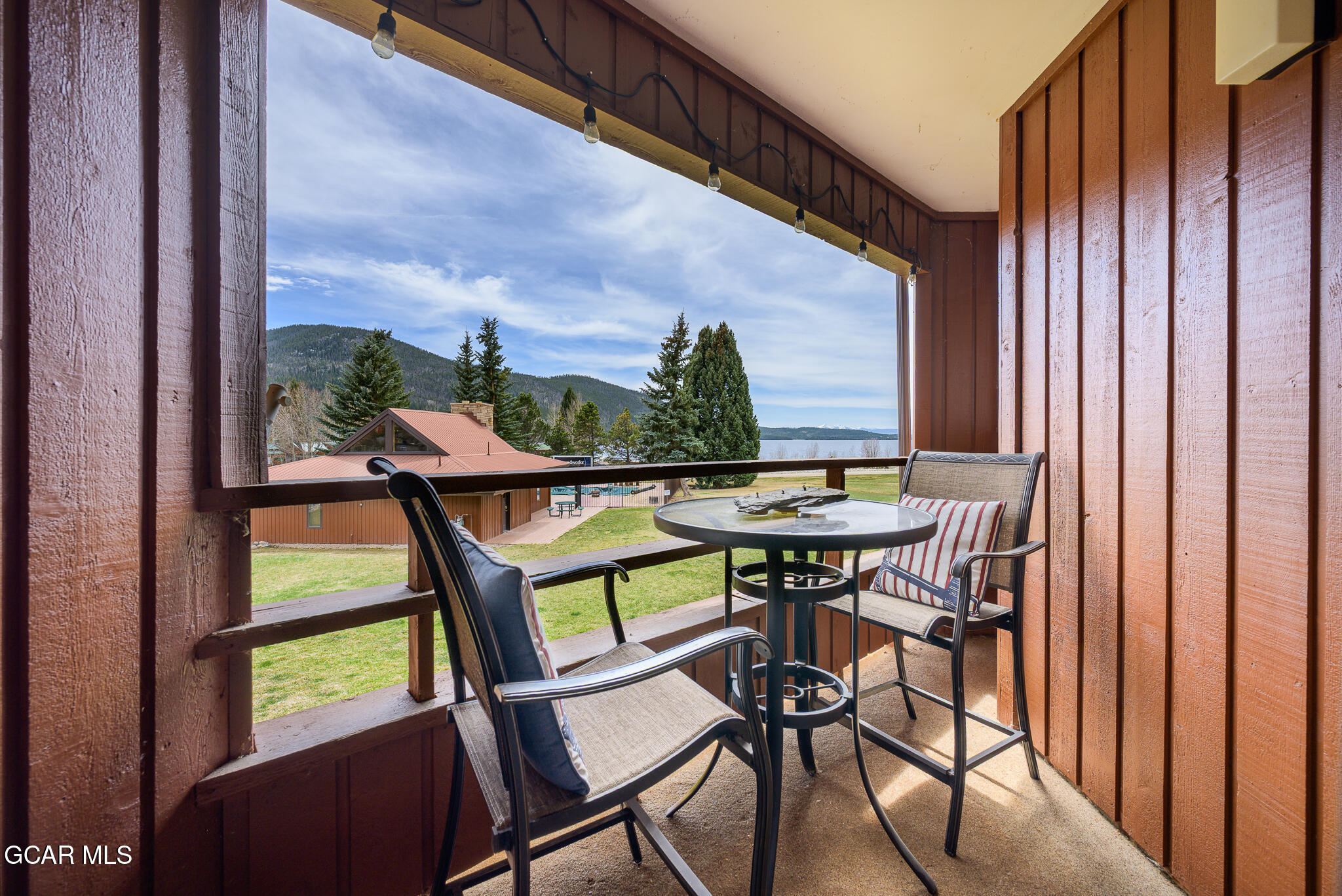 605 Lake Front Road, Unit W8 Grand Lake, CO 80447 - Photo 17 of 28 a view of a chairs and table in the balcony