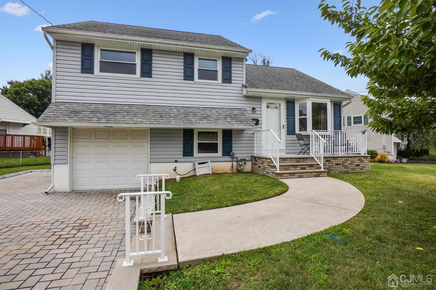 12 Leland Road Edison, NJ 08817 - Photo 2 of 23 a front view of a house with a yard and trees