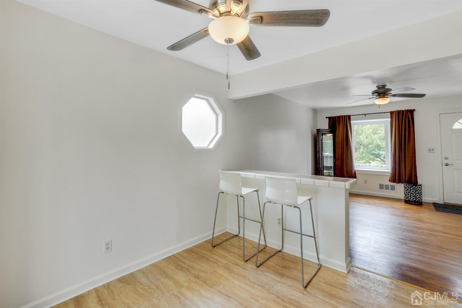 12 Leland Road Edison, NJ 08817 - Photo 11 of 23 a view of a livingroom with a chandelier fan