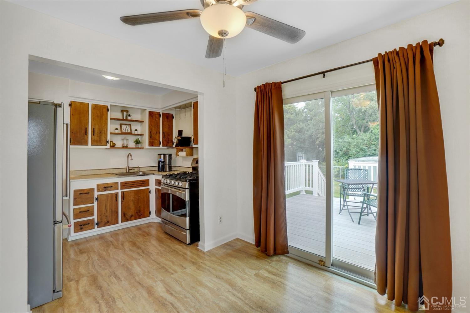 12 Leland Road Edison, NJ 08817 - Photo 13 of 23 a view of a kitchen with a sink wooden floor and a large window