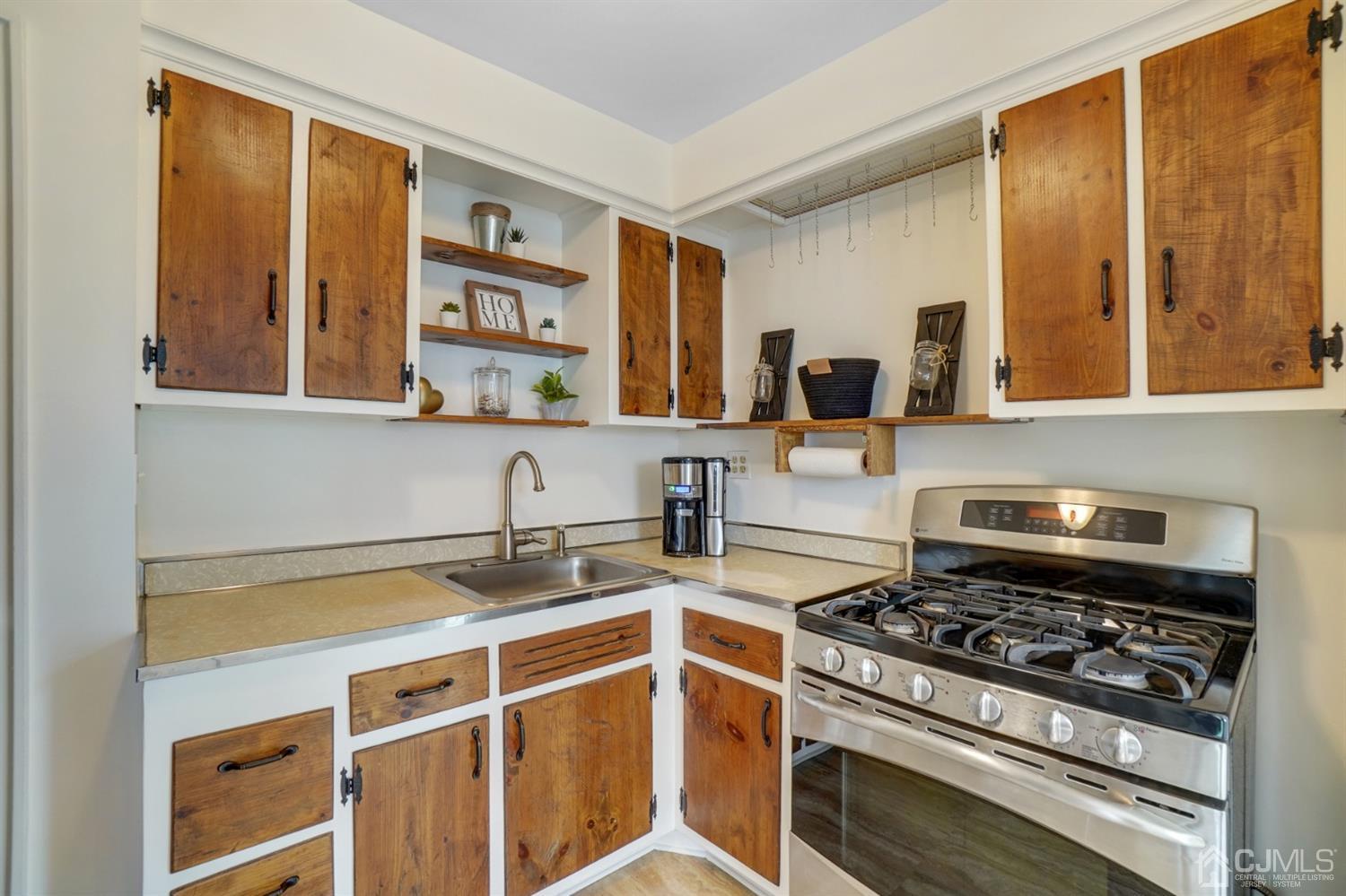 12 Leland Road Edison, NJ 08817 - Photo 14 of 23 a kitchen with a stove and a sink