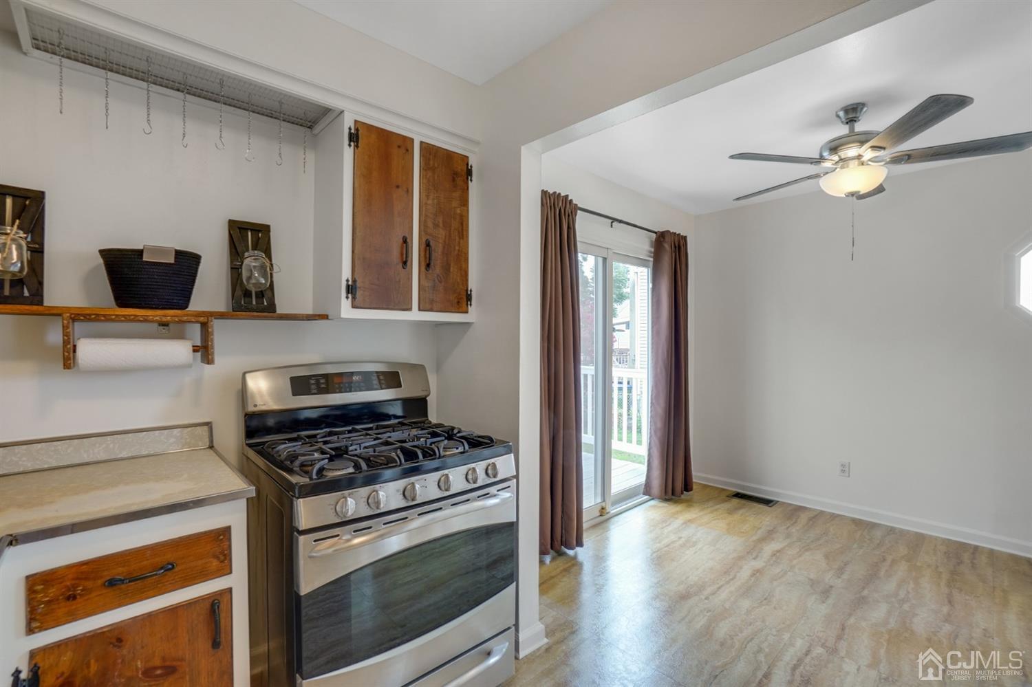 12 Leland Road Edison, NJ 08817 - Photo 15 of 23 a kitchen with stainless steel appliances a stove and a refrigerator