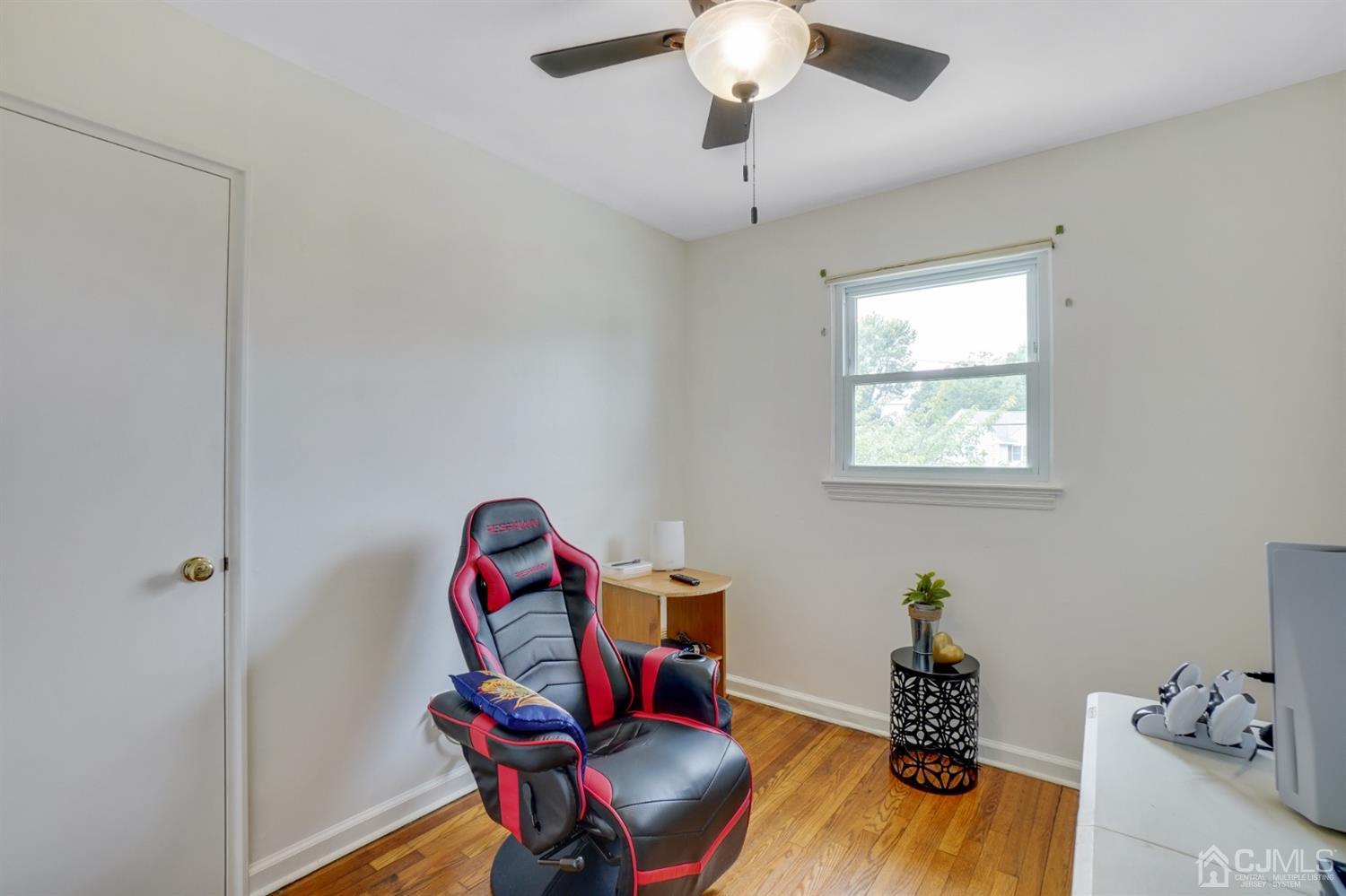 12 Leland Road Edison, NJ 08817 - Photo 18 of 23 a workspace with furniture and wooden floor