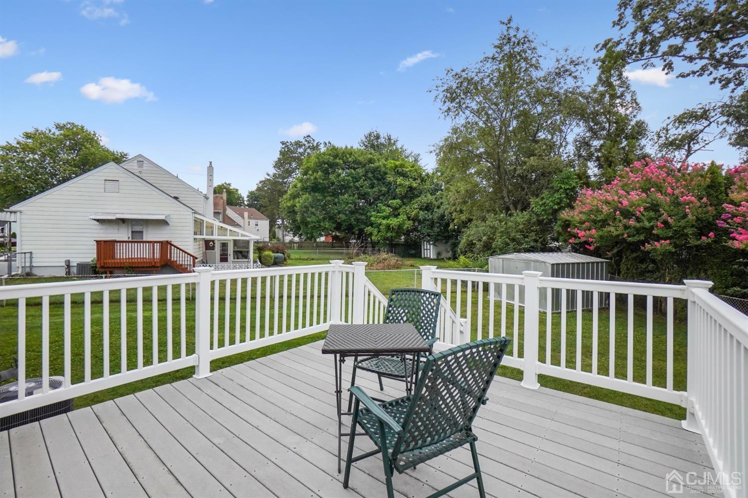 12 Leland Road Edison, NJ 08817 - Photo 5 of 23 a view of a wooden deck with furniture