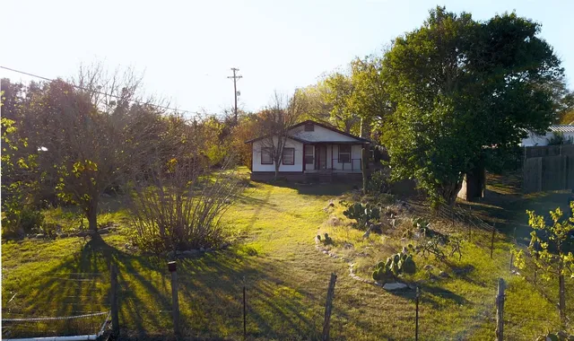 a view of a backyard of the house