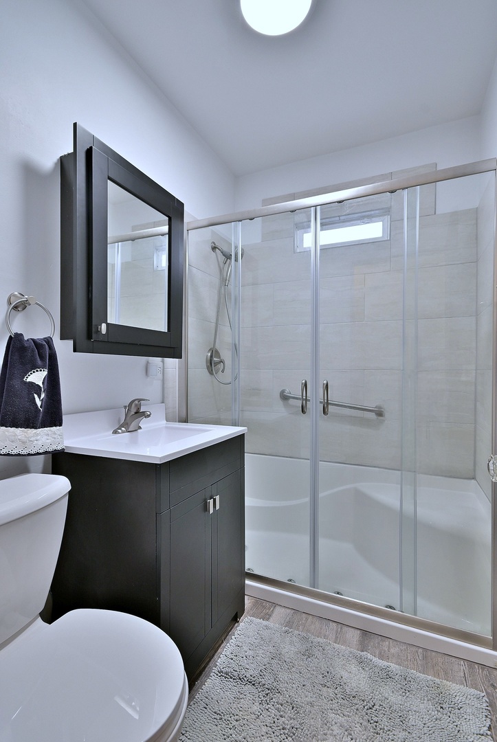 2852 North Meade Avenue Chicago, IL 60634 - Photo 14 of 31 a bathroom with a sink toilet and shower