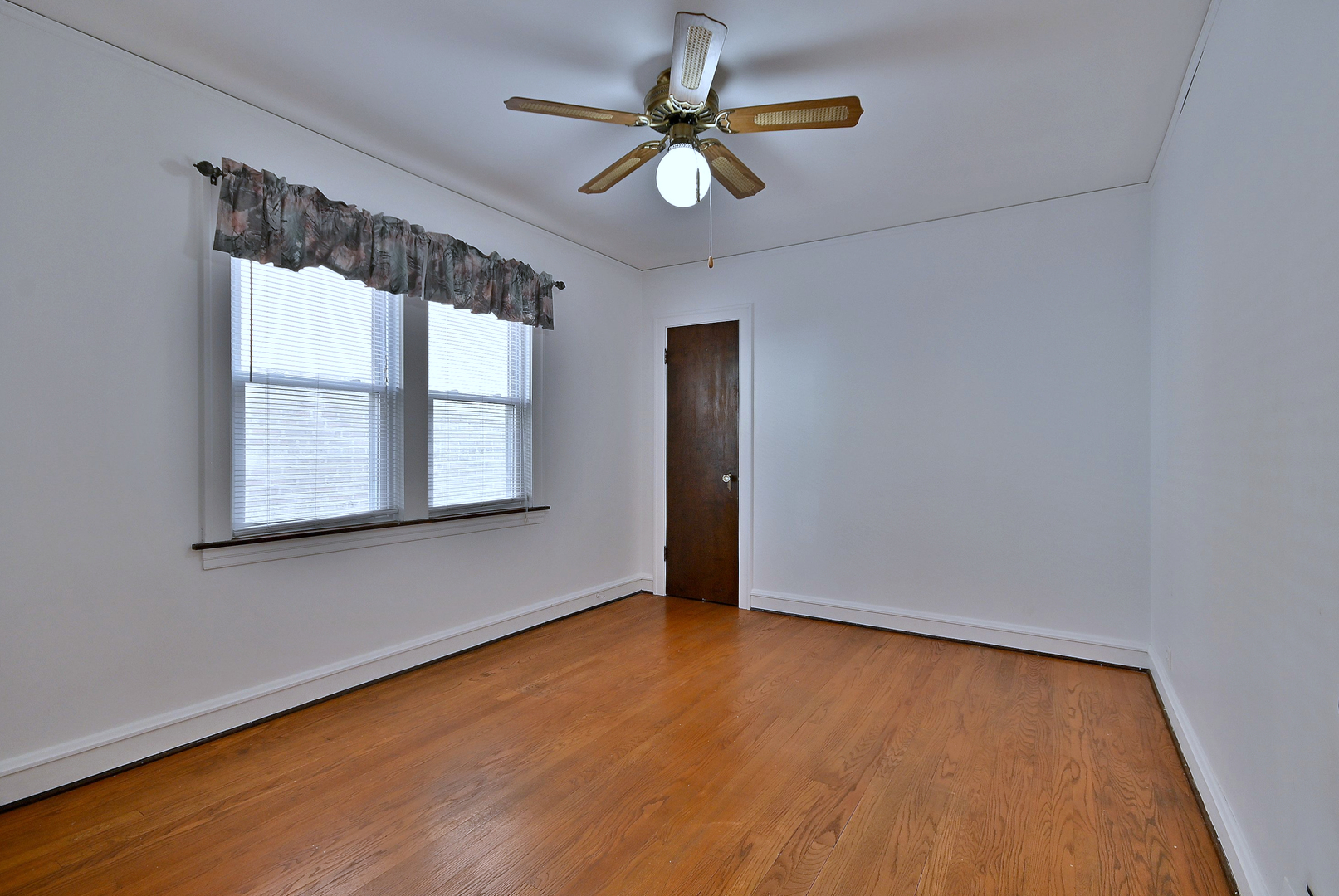 2852 North Meade Avenue Chicago, IL 60634 - Photo 16 of 31 wooden floor in an empty room with a window