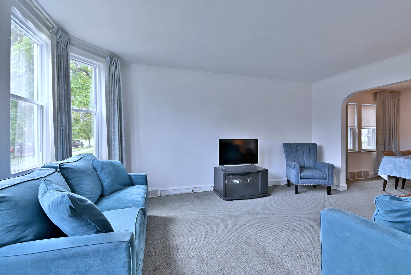2852 North Meade Avenue Chicago, IL 60634 - Photo 2 of 31 a living room with furniture and a flat screen tv
