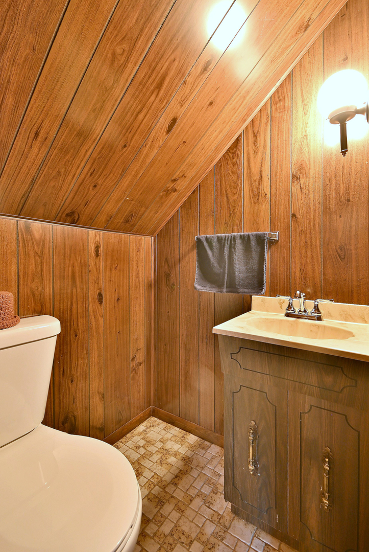 2852 North Meade Avenue Chicago, IL 60634 - Photo 23 of 31 a bathroom with a sink a toilet and shower