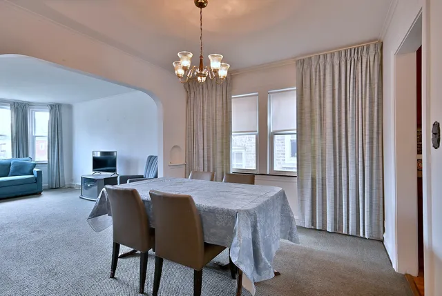a view of a dining room with furniture window and outside view