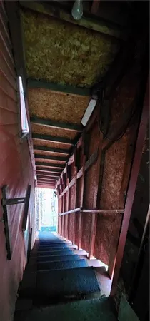 a bedroom with a bed and a furniture