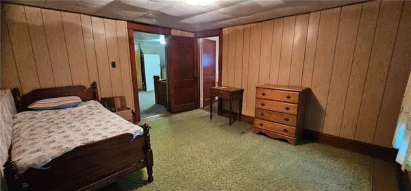 a view of kitchen cabinets and wooden floor