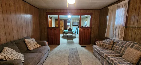 a living room with furniture and a gate
