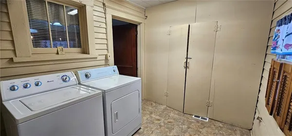 a view of storage and utility room with washer and dryer