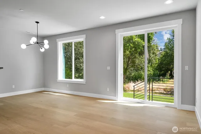 a view of kitchen with microwave and cabinets