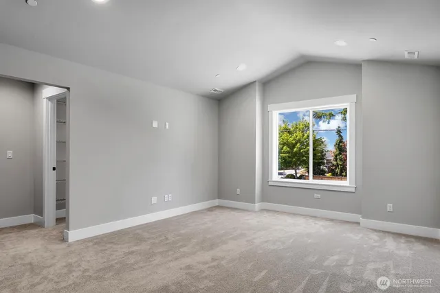 a bathroom with a granite countertop sink mirror and a bathtub