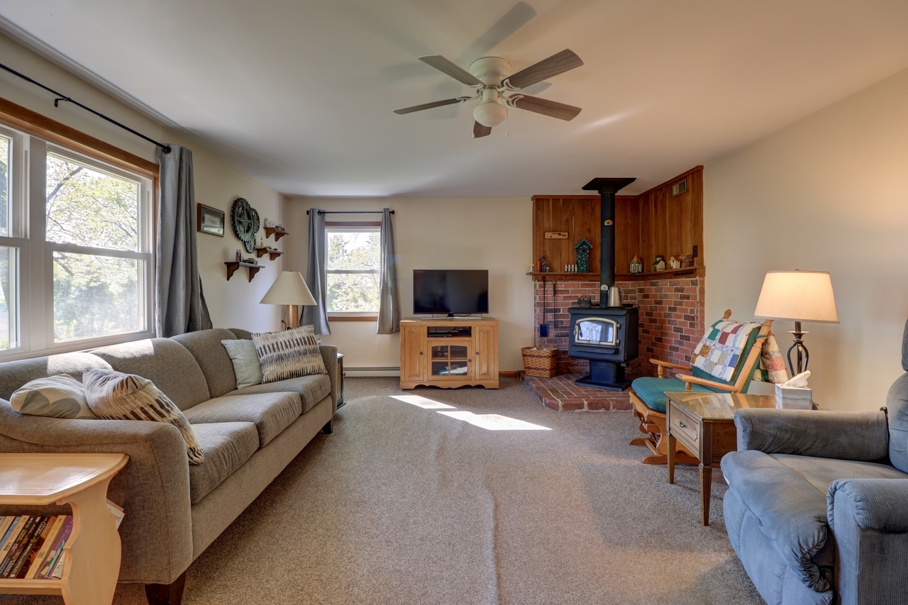 14755 Fenton Road Morrison, IL 61270 - Photo 6 of 34 a living room with furniture and a flat screen tv