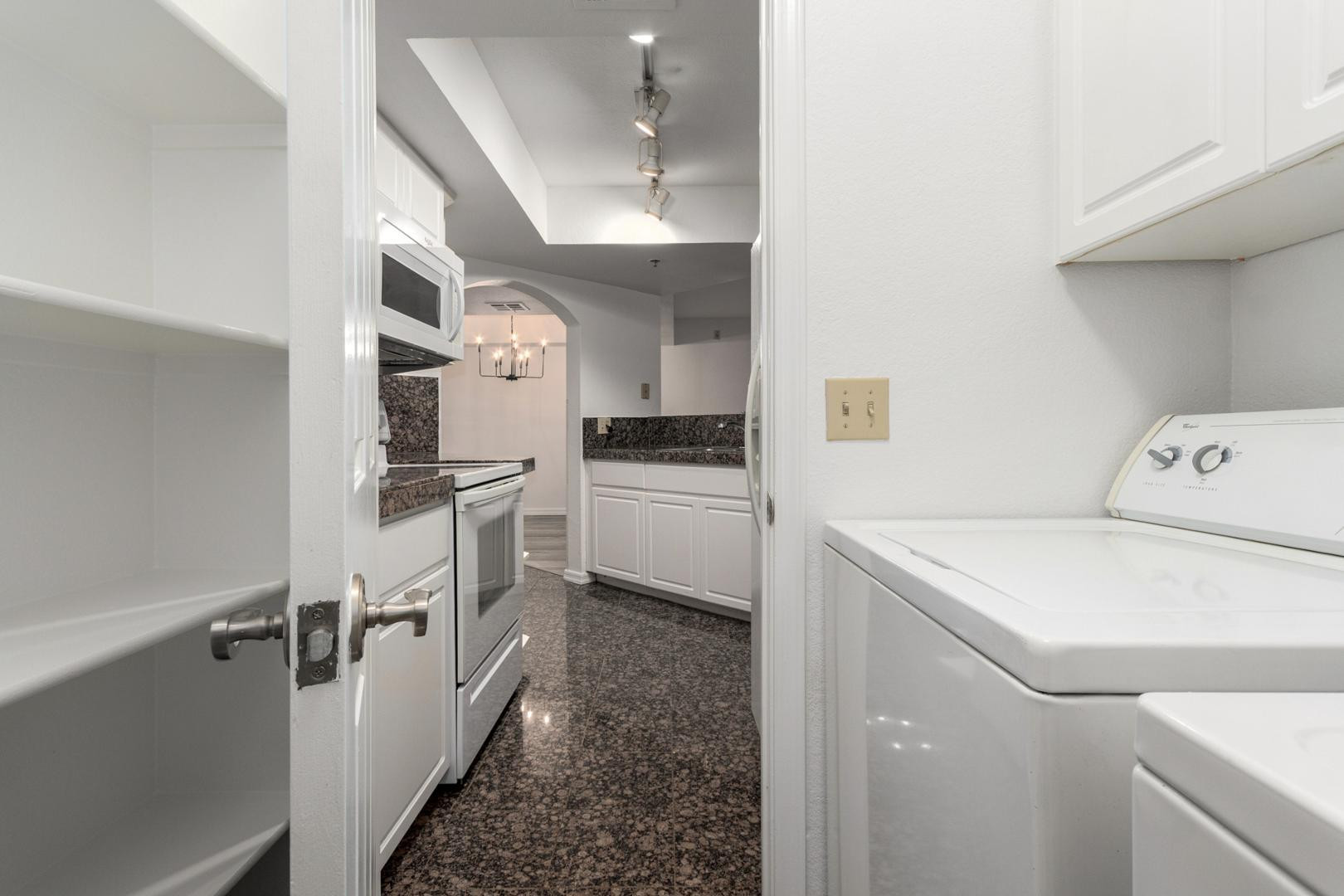 5104 North 32nd Street, Unit 225 Phoenix, AZ 85018 - Photo 14 of 31 a kitchen with a sink a stove and refrigerator