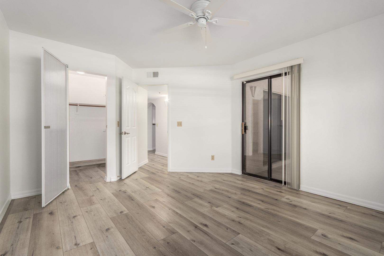 5104 North 32nd Street, Unit 225 Phoenix, AZ 85018 - Photo 16 of 31 a view of an empty room with wooden floor