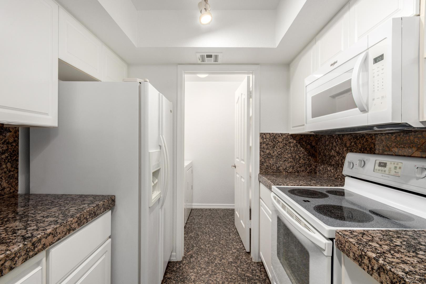 5104 North 32nd Street, Unit 225 Phoenix, AZ 85018 - Photo 19 of 31 a kitchen with a stove and a sink