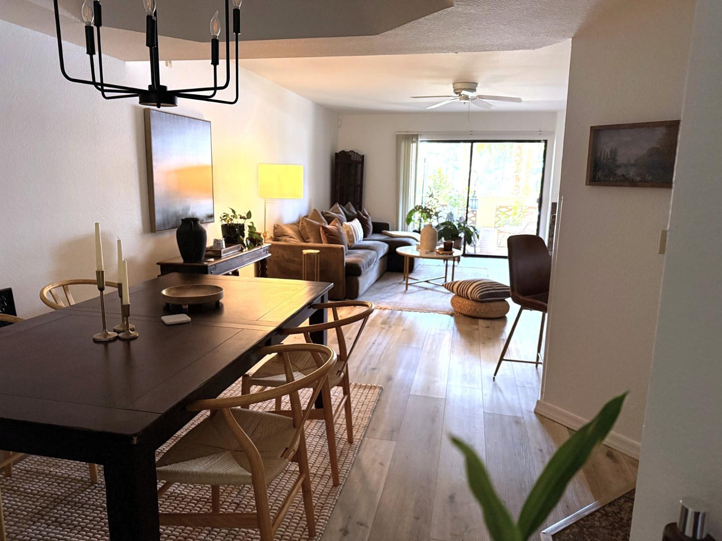 5104 North 32nd Street, Unit 225 Phoenix, AZ 85018 - Photo 22 of 31 a living room with dining table a flat screen tv and couches