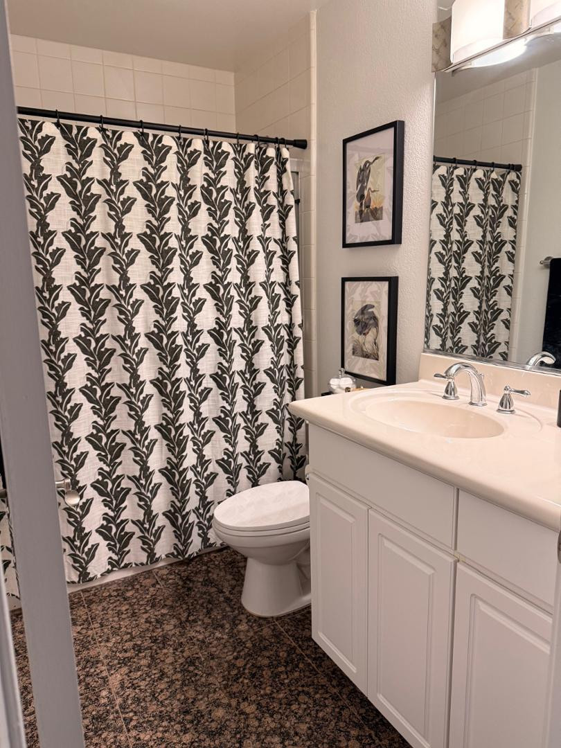 5104 North 32nd Street, Unit 225 Phoenix, AZ 85018 - Photo 27 of 31 a bathroom with a sink toilet and shower