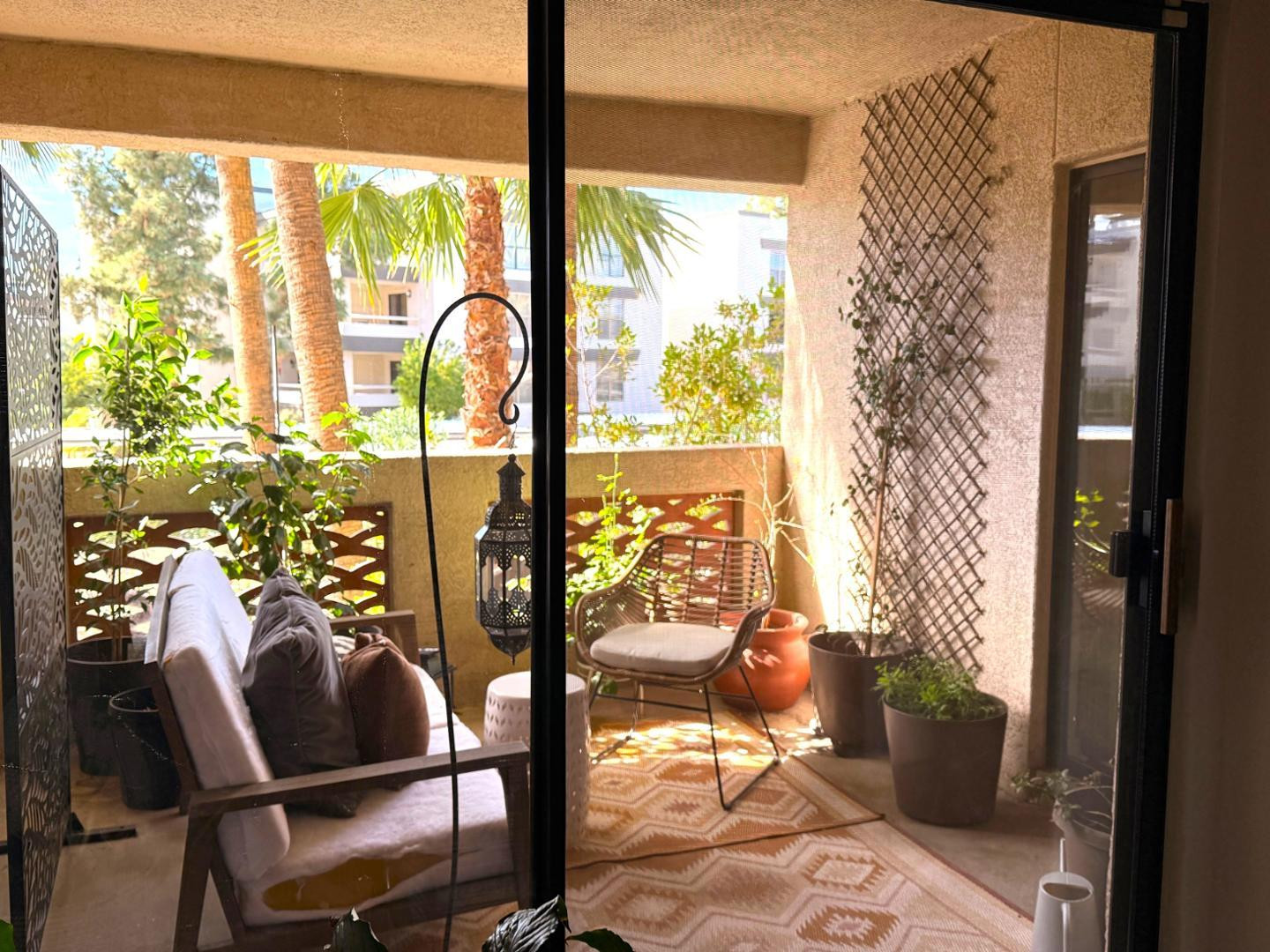 5104 North 32nd Street, Unit 225 Phoenix, AZ 85018 - Photo 6 of 31 a view of a porch with chairs and backyard of the house